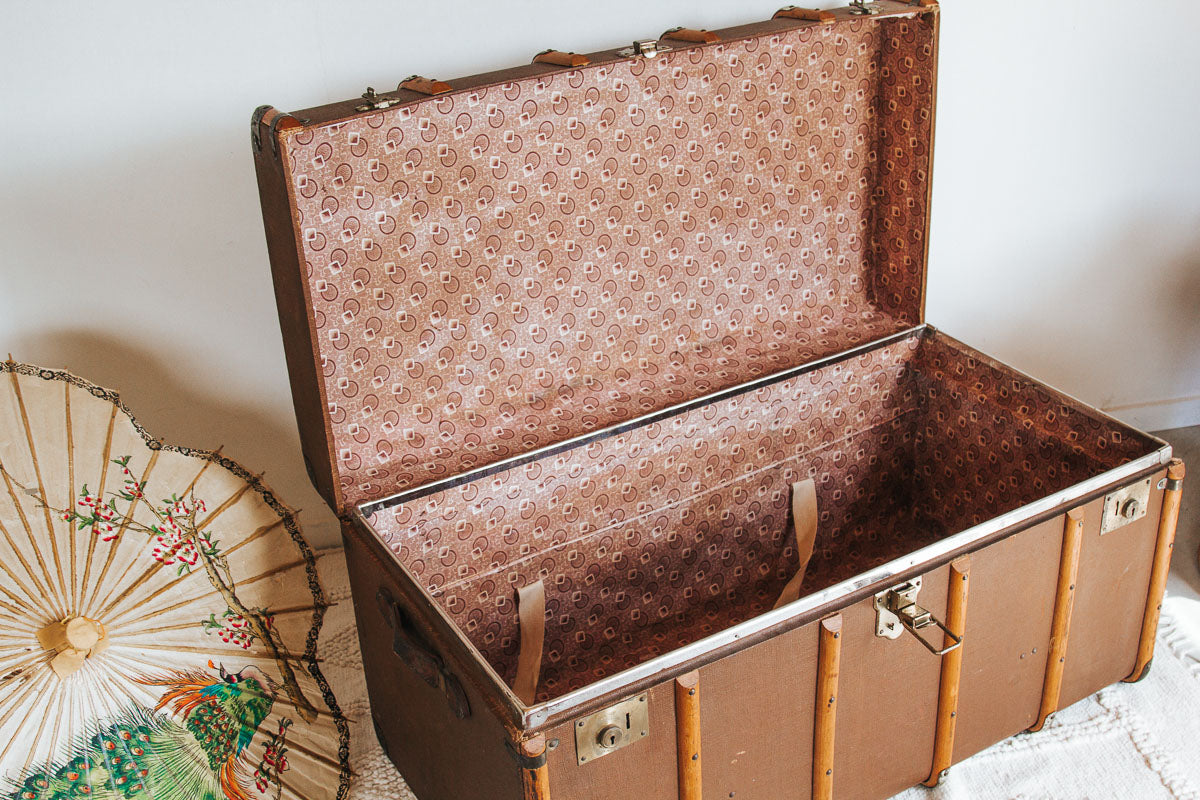 vintage boho storage chest traval trunk with wooden runners and leather handles
