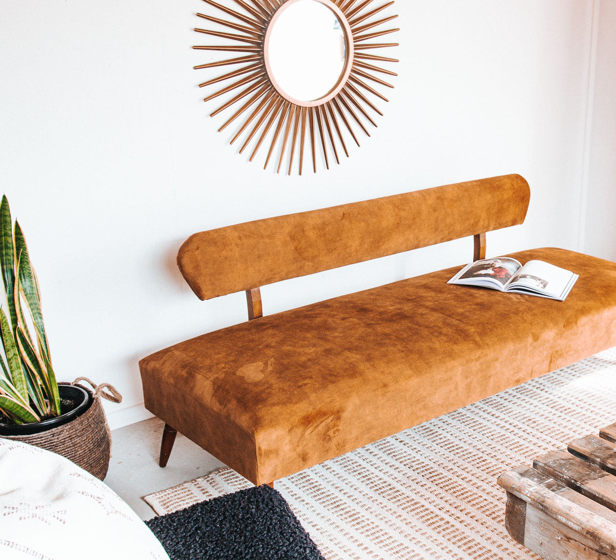 vintage boho mid century modern sofa with oak back and wooden legs.  upholstered in suede-like buttery soft mustard gold velvet couch