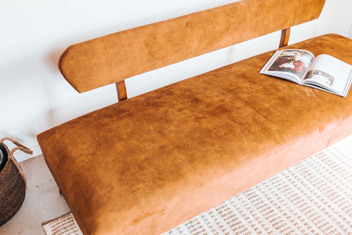 vintage boho mid century modern sofa with oak back and wooden legs.  upholstered in suede-like buttery soft mustard gold velvet couch