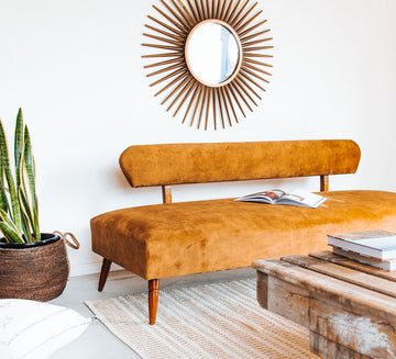 vintage boho mid century modern sofa with oak back and wooden legs.  upholstered in suede-like buttery soft mustard gold velvet couch