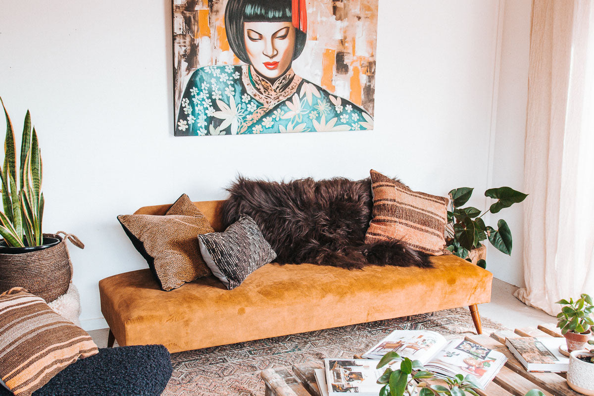 vintage boho mid century modern sofa with oak back and wooden legs.  upholstered in suede-like buttery soft mustard gold velvet couch