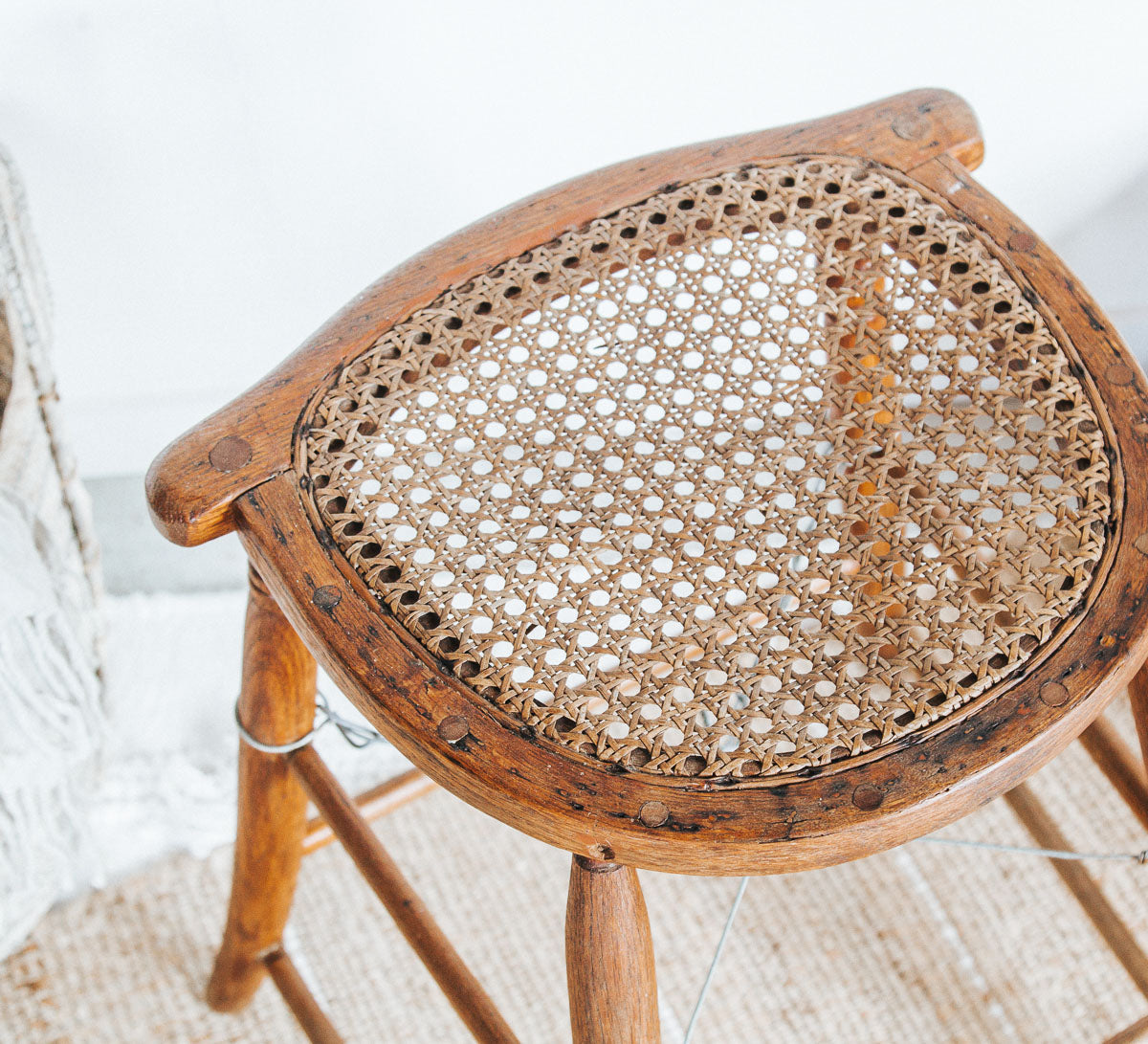 vintage boho antique woven cane with wooden oak legs, stool