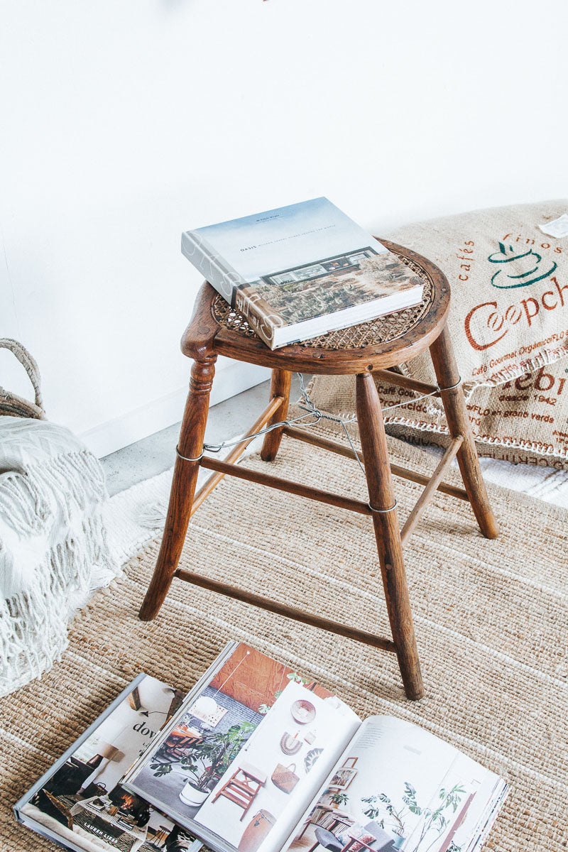 vintage boho antique woven cane with wooden oak legs, stool