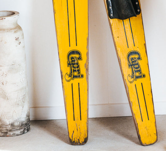 bright yellow vintage boho wooden antique water skis made by fred williams