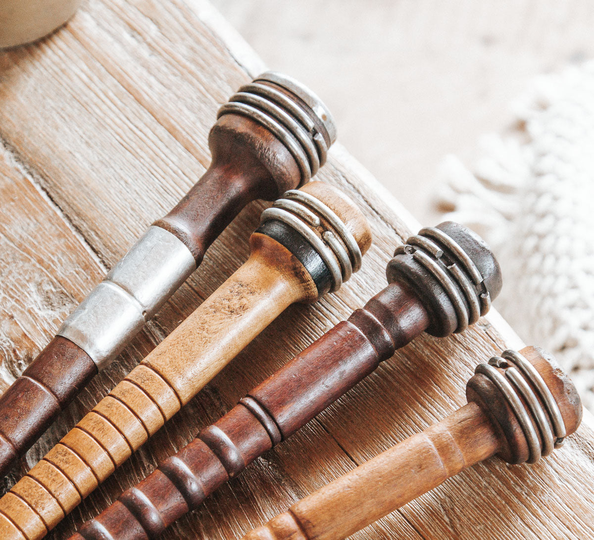 vintage wooden and metal sewing spools