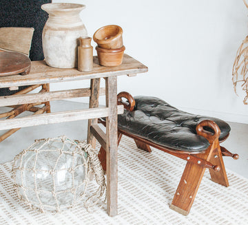 vintage boho camel saddle stool with black leather seat, brass inlaid wooden legs