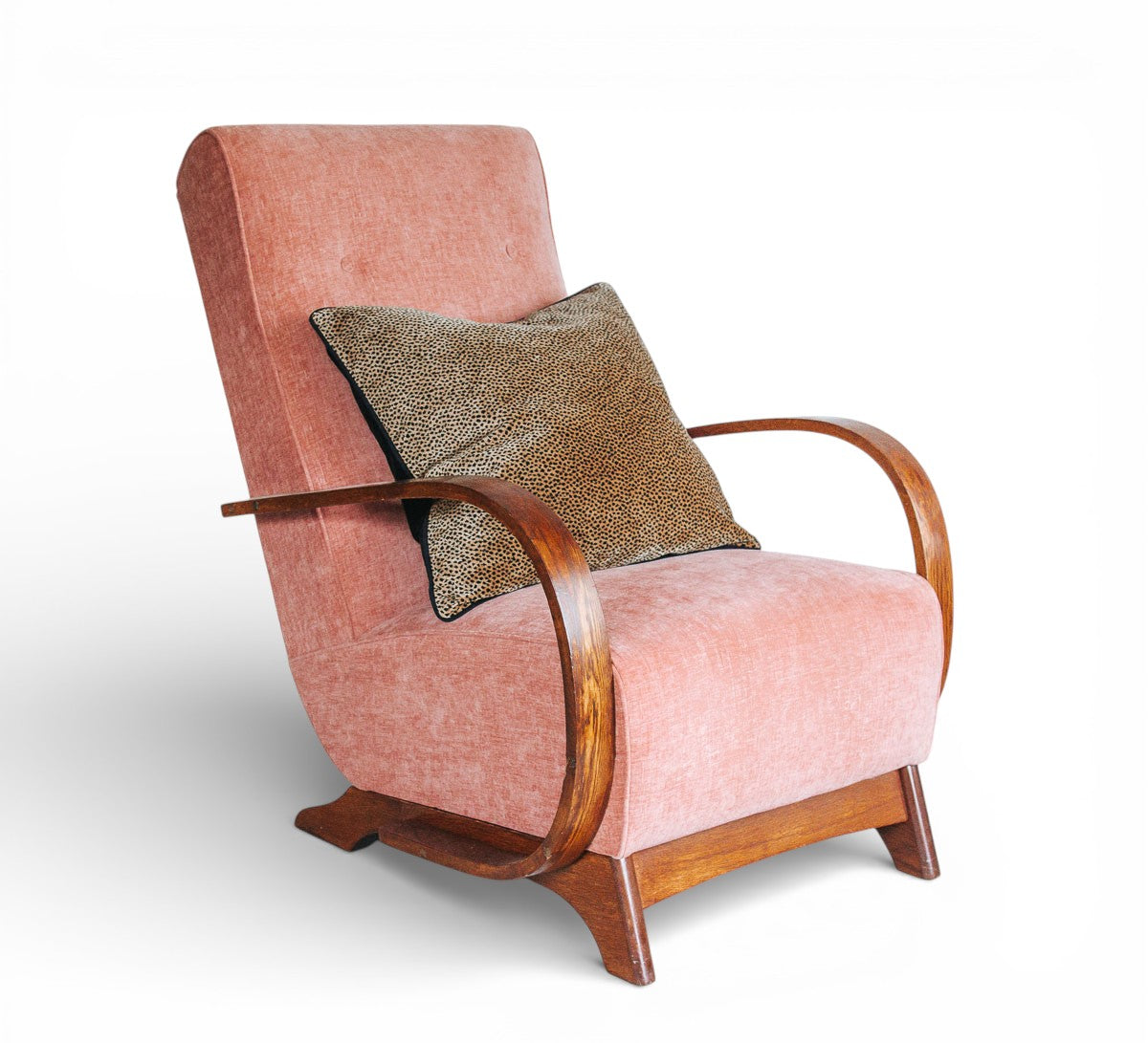 vintage boho mid century oak framed lounge chair with curved wooden arms and soft peach pink velvet seat