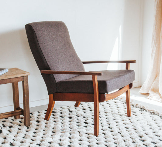 Vintage mid century modern armchair with wooden frame and textured brown upholstery
