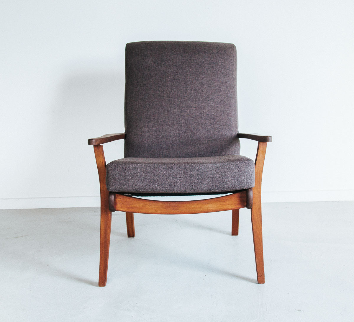 Vintage mid century modern armchair with wooden frame and textured brown upholstery
