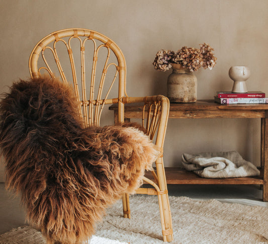 vintage retro boho bohemian designer cane rattan chairs with rustic sheepskin