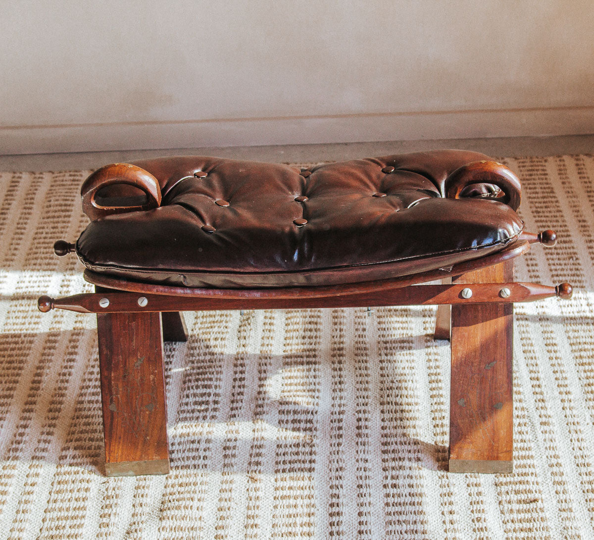 vintage bohemian wood and leather camel stool with brass inlay