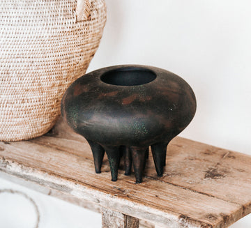 boho sculptural gallery style matt black tribal style vase vessel with sculptural legs