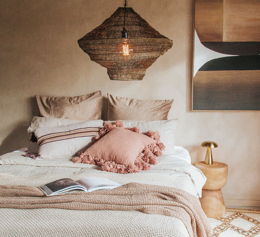 madam stoltz scandi boho cotton textured cushion with oversize tassles in burnt sugar soft blush pink throw pillow