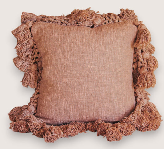 madam stoltz scandi boho cotton textured cushion with oversize tassles in burnt sugar soft blush pink throw pillow