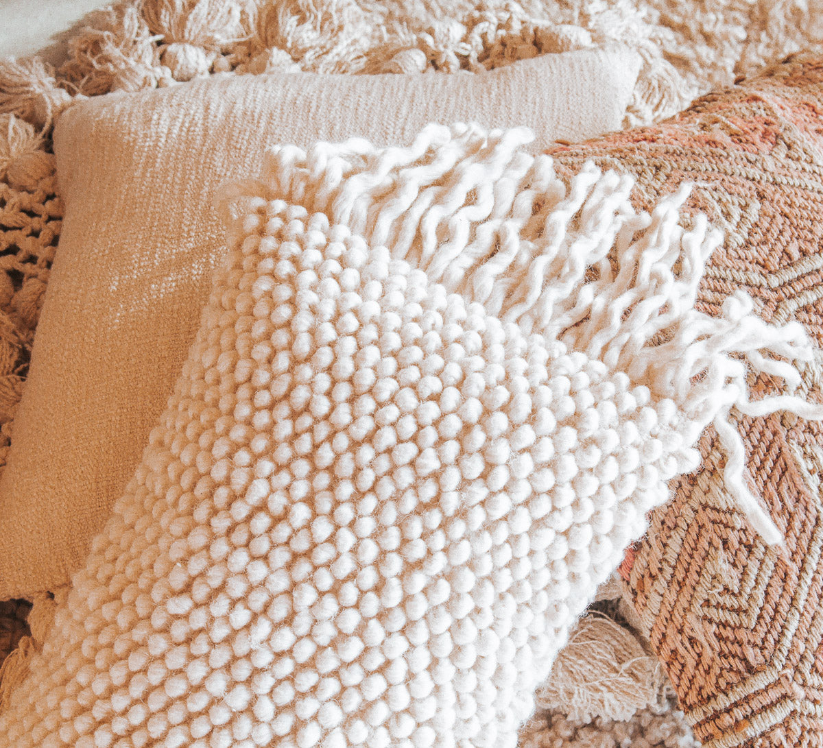 designer boho wool bobble and tassle breakfast cushion pillow