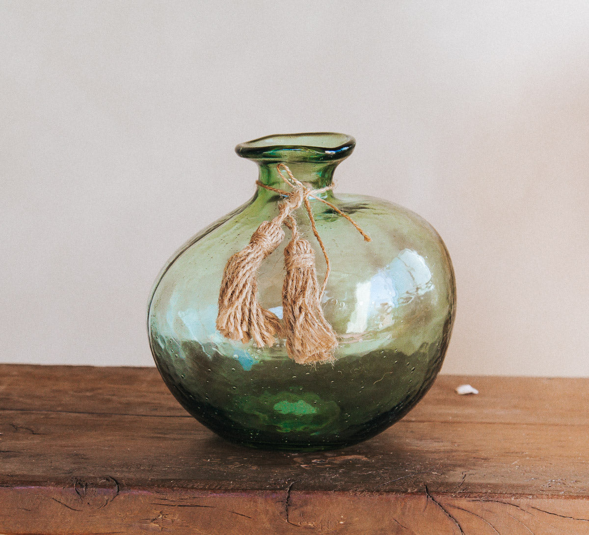 boho handmade glass organic vase made by madam stoltz with jute tassles
