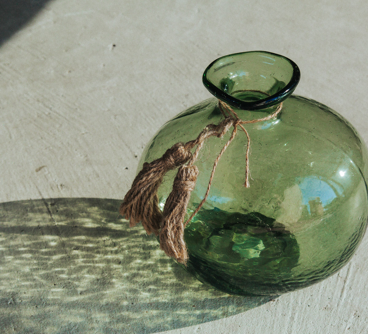 boho handmade glass organic vase made by madam stoltz with jute tassles