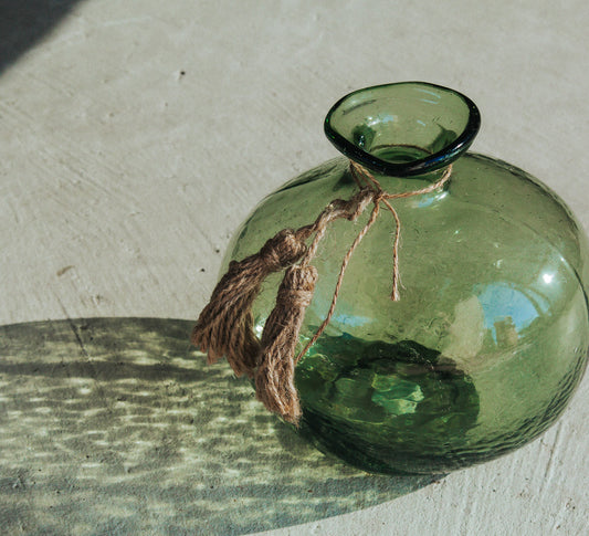 boho handmade glass organic vase made by madam stoltz with jute tassles