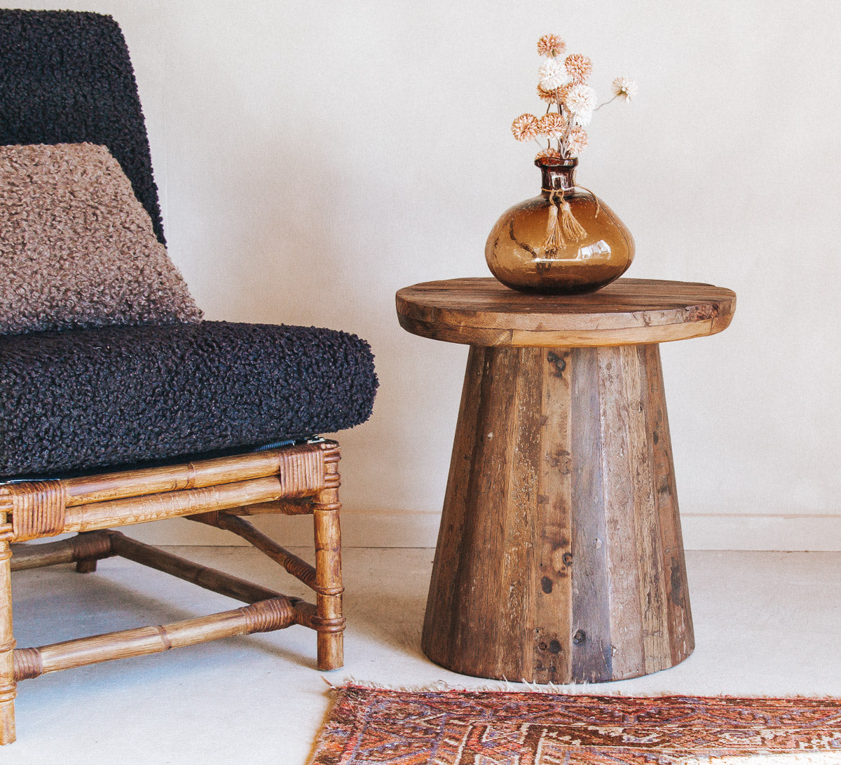 vintage reclaimed timber wooden rustic side table with designer bohemian fell.  round with solid wood top and unique grain and character