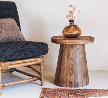 vintage reclaimed timber wooden rustic side table with designer bohemian fell.  round with solid wood top and unique grain and character