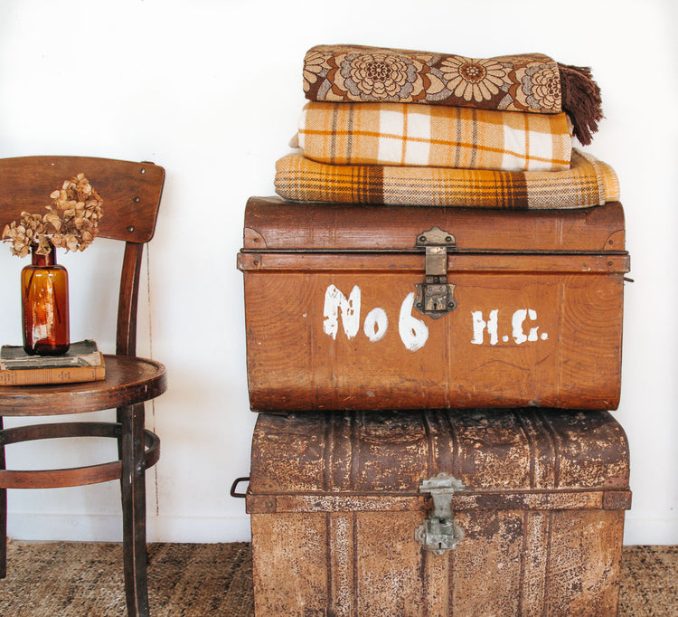 Funky vintage suitcases with vintage chair and home decor