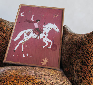 framed glass print of cowboy riding his star horse