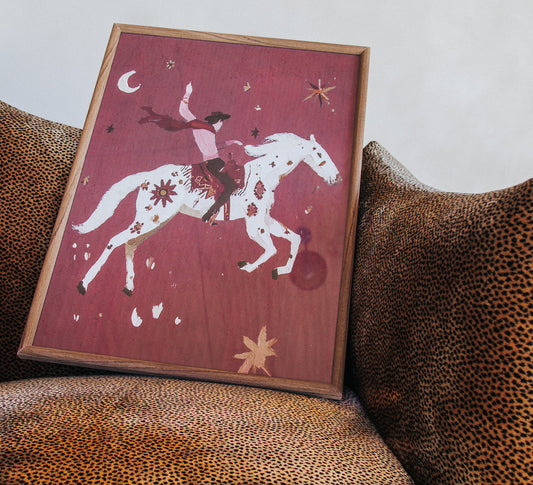 framed glass print of cowboy riding his star horse