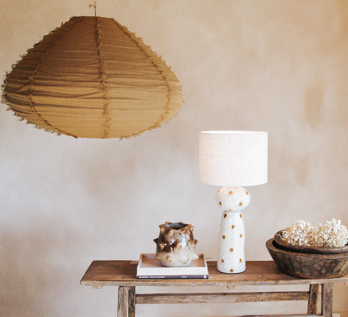 designer boho inerior design ceramic statement lamp with textured glazed and spotted caramel dots