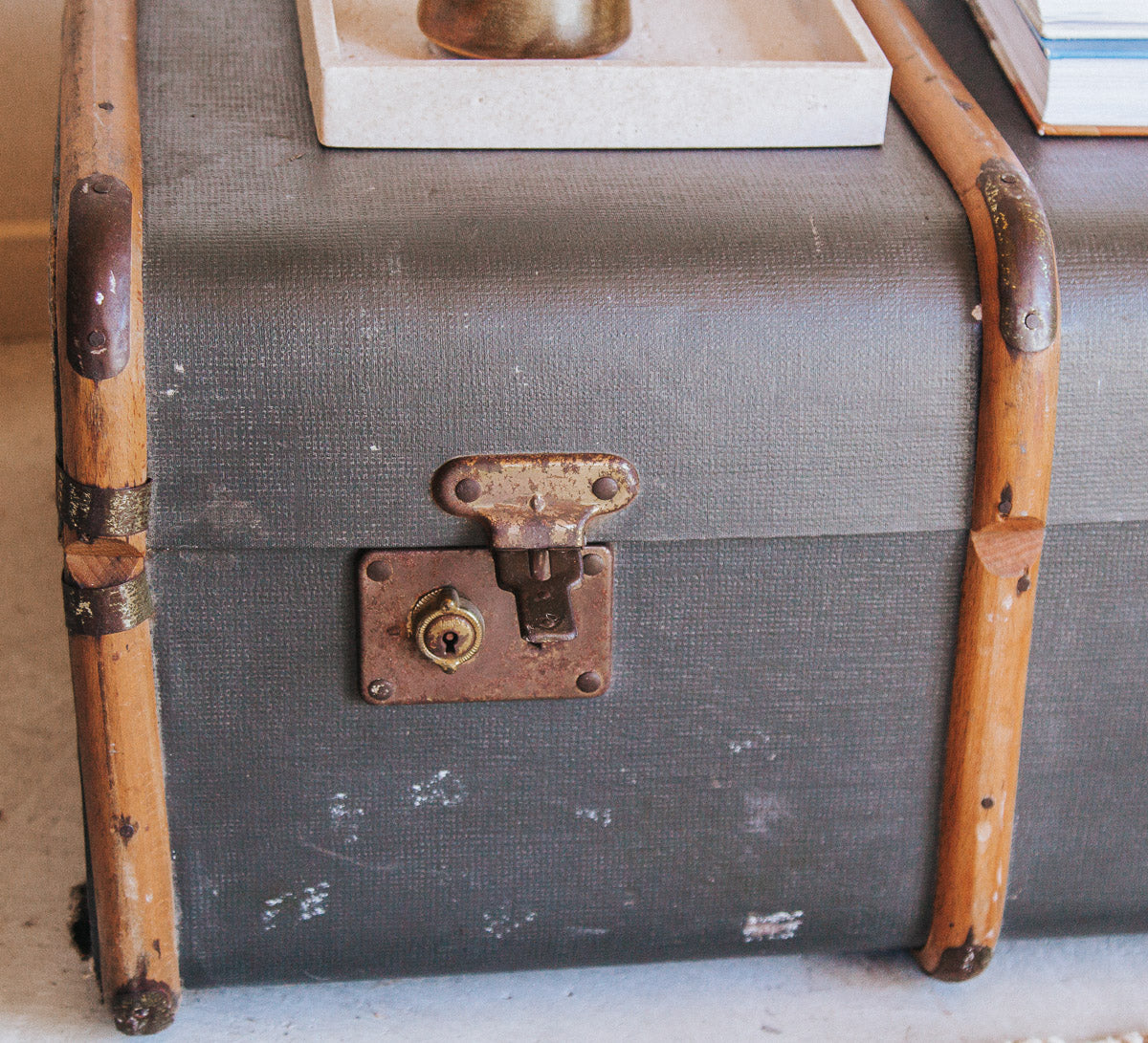 vintage boho antique canvas travel trunk with wooden runners and brass metal corners