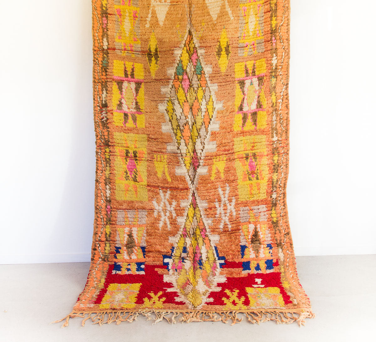 vintage moroccan wool boujaad rug in yellow and peach tones with diamond pattern