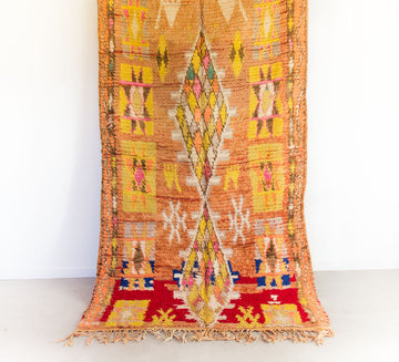 vintage moroccan wool boujaad rug in yellow and peach tones with diamond pattern