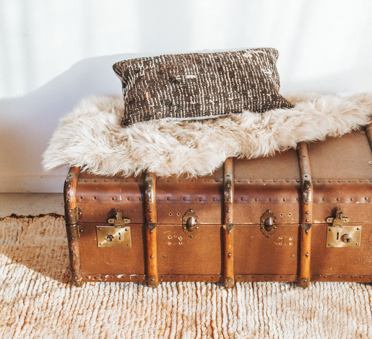 vintage boho retro antique canvas suitcase trunk with wooden runners and metal edges.  Cool industiral vibe.  Use it as as table or storage