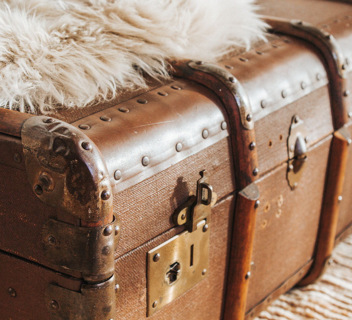 vintage boho retro antique canvas suitcase trunk with wooden runners and metal edges.  Cool industiral vibe.  Use it as as table or storage