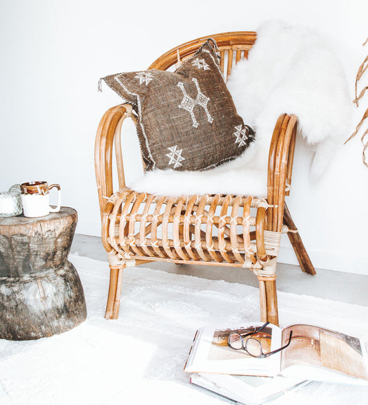 boho nz longwool sheepskin in ivory whitecane chair made from rattan and cane bamboo.  verandah chair, lounge chair