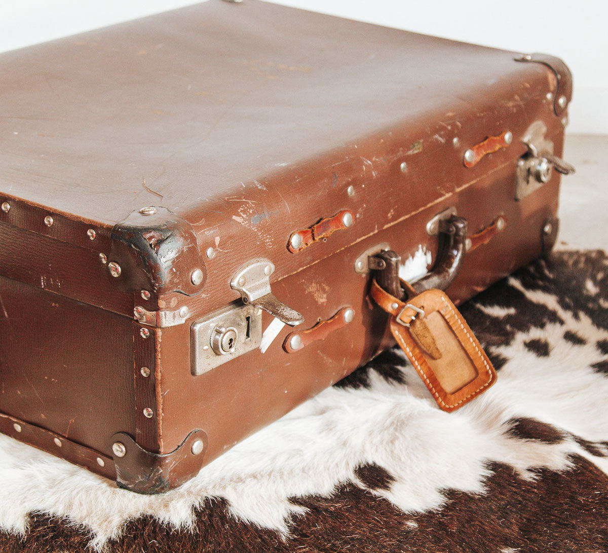 antique vintage boho suitcase with leather straps