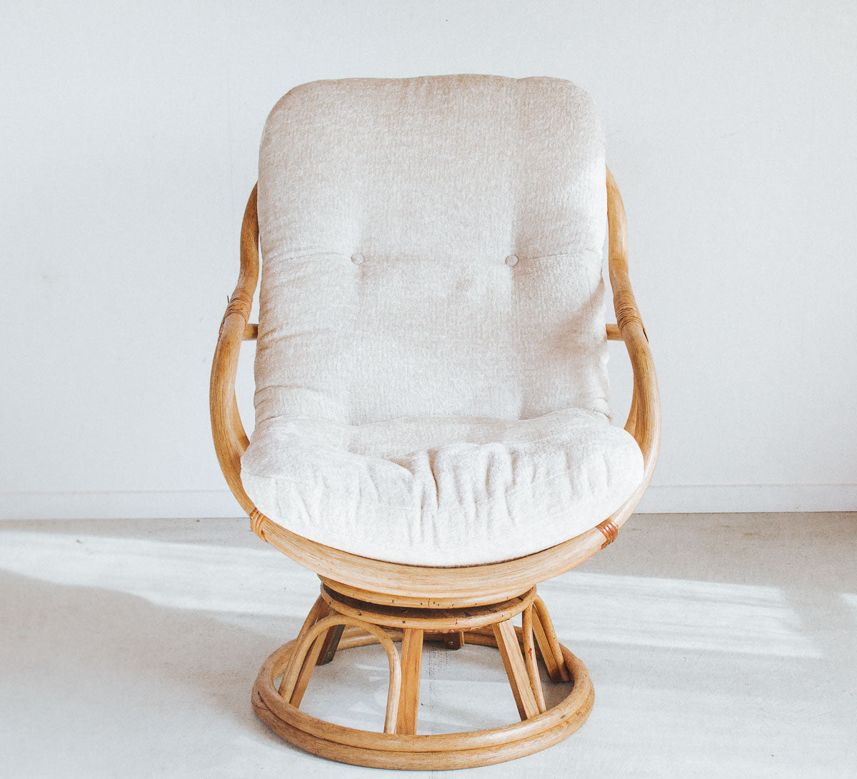 vintage cane rattan boho swivel armchair with upholstered velvet cushion