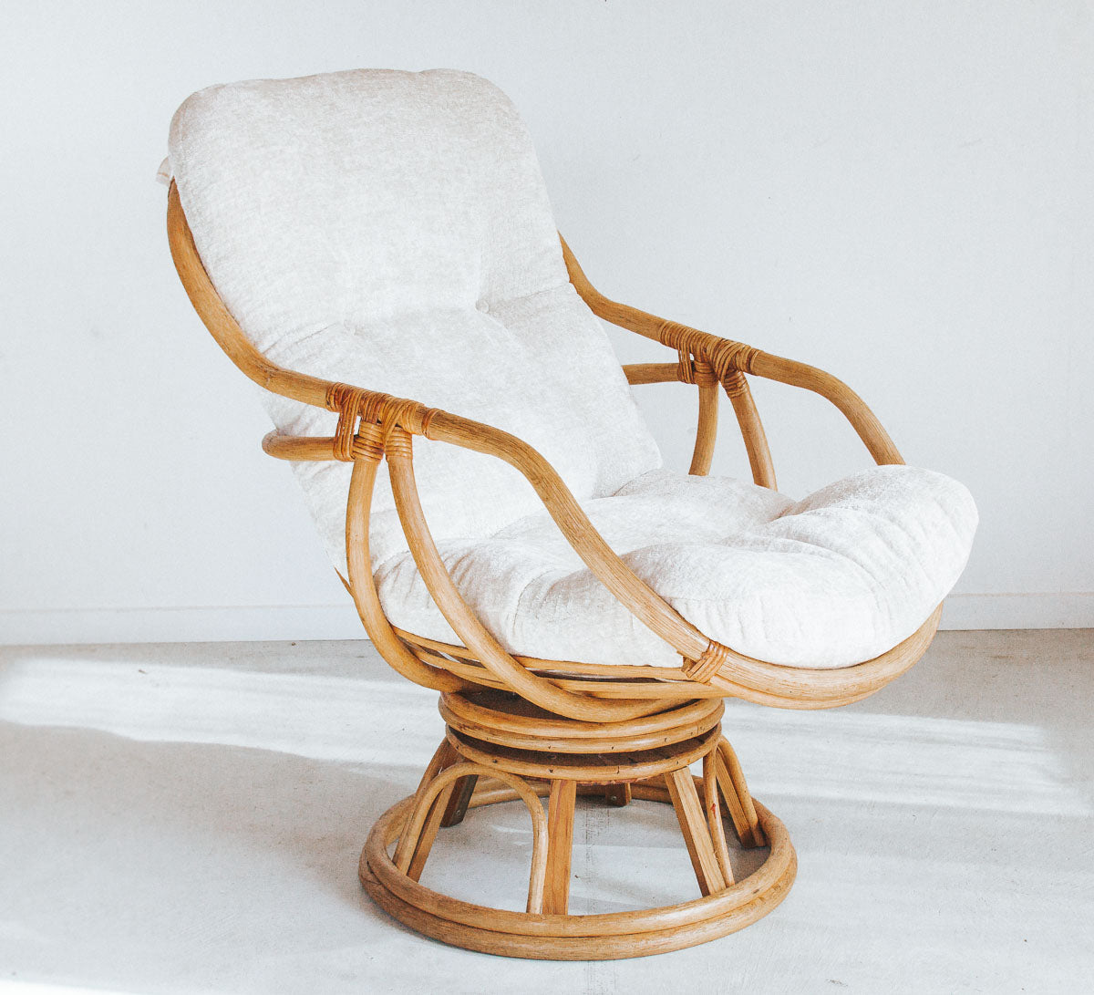vintage cane rattan boho swivel armchair with upholstered velvet cushion