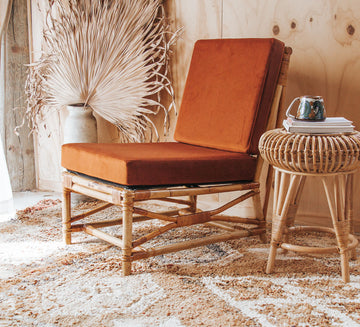 vintage boho cane rattan armchair covered in tangerine velvet fabric