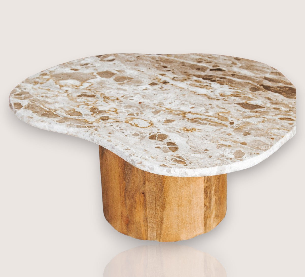 boho designer avi marble coffee table in an organic shape with a round curved solid wood base