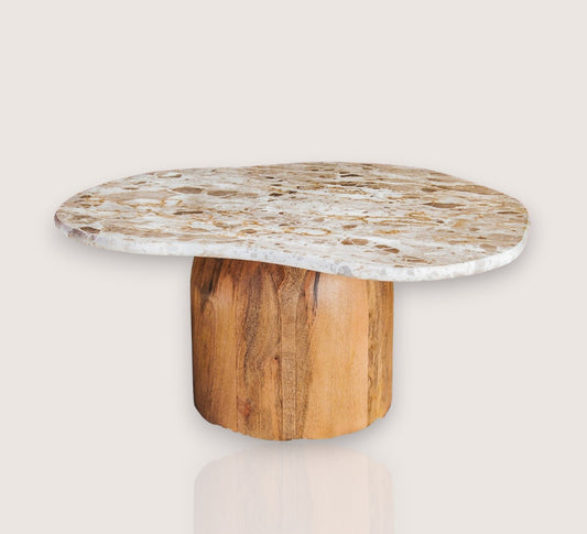boho designer avi marble coffee table in an organic shape with a round curved solid wood base