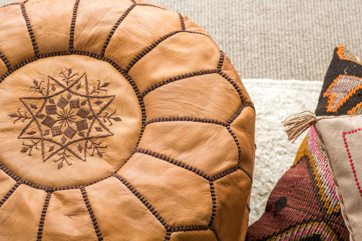 Tan Moroccan leather pouf with brown embroidery and stitchingboho leather tan moroccan floor pouf ottoman