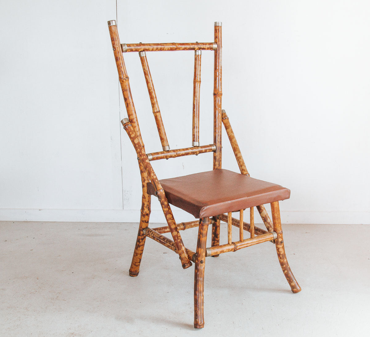 antique vintage boho tiger bamboo cane chair with vinyl seat