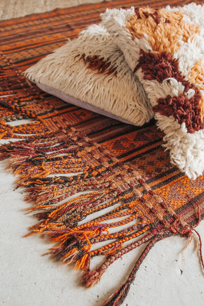 vintage boho handwoven turkish kilim rug throw with tassles in orange and rust colours